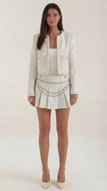 Conjunto Doris de Chaqueta Tweed Corta y Minifalda Plisada